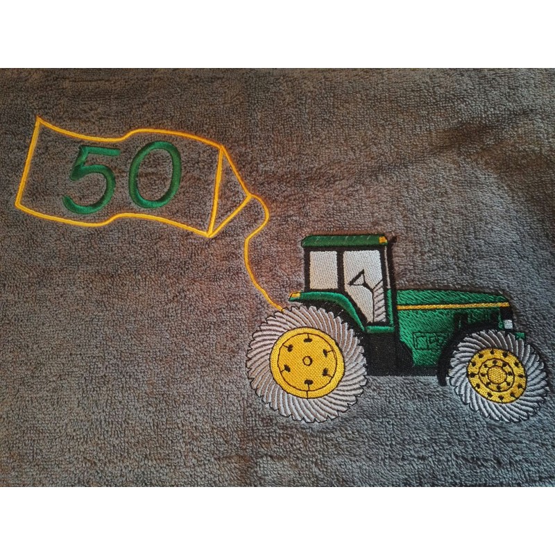 brodeerattu pyyhe traktorikuvalla